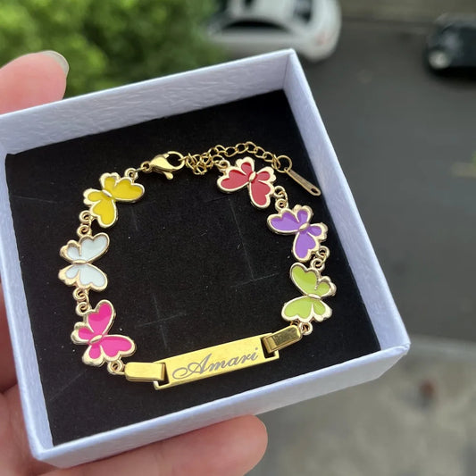 Butterfly-themed bracelet with 'Amari' nameplate in a box