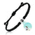 Black braided bracelet with a silver clasp with photo projection of a beach scene charm on a white background
