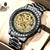 Luxury watch with intricate design and visible brand 'RUIGE' on a beige background