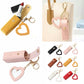 Collage of heart-shaped keychains in various colors with a beige handbag in the background.
