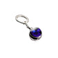 Keychain with a purple and black circular design on a white background