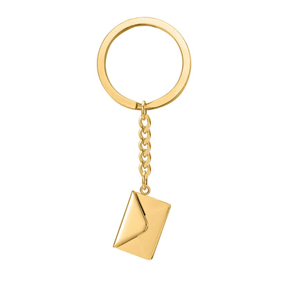 Gold keychain with a geometric pendant on a white background