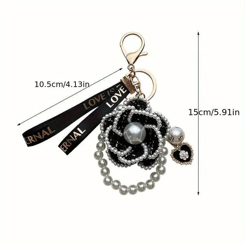 Keychain with decorative elements and measurement indicators on a white background