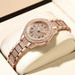 Rose gold watch with diamond accents on a light background