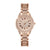 Rose gold watch with diamond accents on a white background
